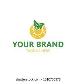 
green and yellow teacup and tea leaf logo image with small circle