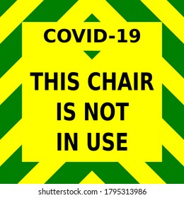 Green and yellow vector graphic, informing people that this chair is not in use, as part of the measures to help stop the spread of the covid-19 virus