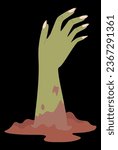 green zombie hand comes out of the ground. Halloween