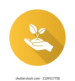 Greening flat design long shadow glyph icon. Environment protection. Open hand with sprout. Agriculture. Vector silhouette illustration