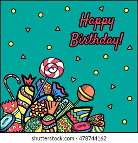 Greeting birthday card. Candy composition on a blue background.