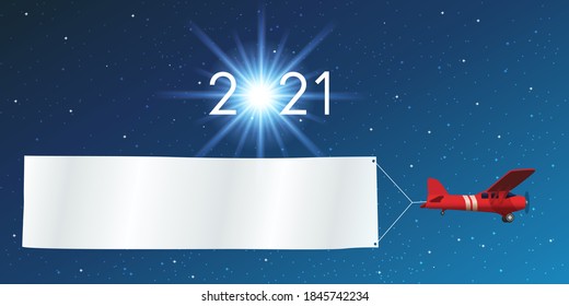 Greeting card 2021 on a starry sky background, with a red airplane pulling a white banner to write a message or wish his best wishes for the new year.