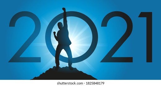 Greeting card 2021 showing a satisfied man raising his fist as a sign of victory after reaching his goal on reaching the top of a mountain.