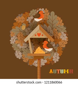 Greeting card with autumn decorative elements. Couple of birds and a bird feeder on leaves background