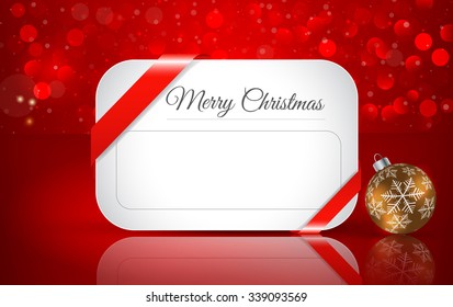 Greeting card for Christmas with  Christmas ball  on winter background with snow and snowflakes