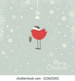 Greeting card with a Christmas ball with a red bird