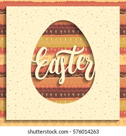 Greeting card concept. Square paper with cut out egg and handwritten lettering "Easter". Seamless colorful pattern on background.