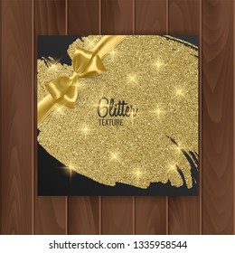 Greeting card cover with golden glittering texture and golden bow. Postcard on a wooden substrate, vector EPS 10 illustration