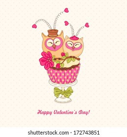 Greeting card with cupcake owls Valentine's Day. 
