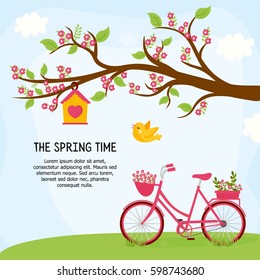 Greeting card design with spring landscape. "The spring time" message and place for your text. Sunny day with blossom tree, blue sky, green meadow and bike. 