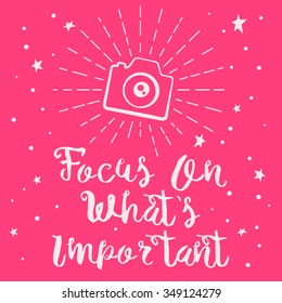 Greeting card with the faim hand drawn effect text "focus on what is important" and camera. Fully editable vector illustration. 
