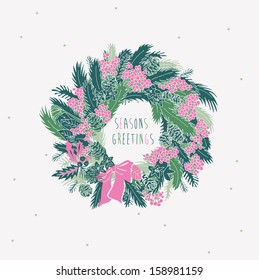 Greeting card with a festive wreath