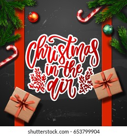  greeting card with gift box .  Xmas vector background. Hand drawn calligraphy. concept handwritten  Christmas in the air