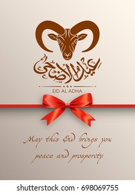 Greeting card with goat face and Arabic calligraphy of Eid Al Adha for the celebration of Muslim community festival.