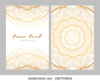 Greeting card golden ethnic patterns on white background