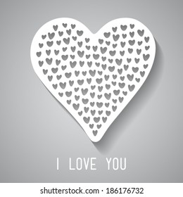 Greeting card "I love you" with a sticker in the shape of heart consisting of little hearts