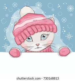 Greeting card with illustration of cute kitten .Its is wearing a knitted hat and mittens with ornament.and drawing