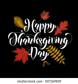 Greeting card lettering. Text Happy Thanksgiving Day on black background with autumn leaves. 