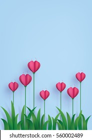 Greeting card of love and Valentine's Day. Heart shape flowers on the grass ,paper art craft style.