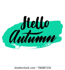 Greeting card with phrase Hello Autumn. Spot on the background. Vector isolated illustration: brush calligraphy, hand lettering. Inspirational typography poster. For calendar, postcard and decor.