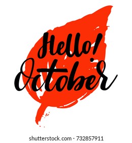 Greeting card with phrase Hello October. Leaf on the background. Vector isolated illustration: brush calligraphy, hand lettering. Inspirational typography poster. For calendar, postcard and decor.