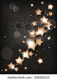 Greeting card with shiny gold stars on the dark background