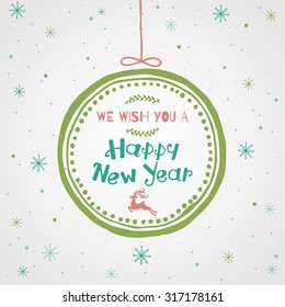 Greeting Card. We wish you a happy new year lettering in the Christmas ball.  Vector illustration