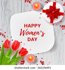 Greeting card for Women's Day. Top view on composition with flowers, gift box, candles and confetti. Vector illustration with serpentine on wooden texture.