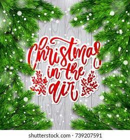 Greeting card with wreath. Christmas vector background. Hand drawn calligraphy - Christmas in the Air 