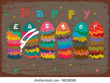Greeting Easter card with stacks of colored eggs and rabbit.