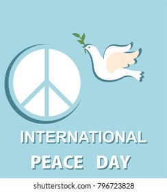 Greeting pastel blue card with paper cut out dove and peace symbol for International Peace day