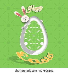 Greeting poster for Happy Easter holiday with green egg cut from paper, peeping rabbit, shadow, geometric pattern and text on the green background with pattern.