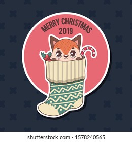 Greeting with s cute little fox in a Christmas stocking