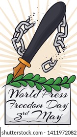 Greeting sign and fountain pen over olive branch breaking a chain as a symbol of free journalism during World Press Freedom Day this 3rd May.