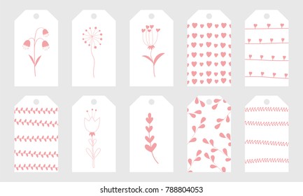 Greeting tags with cute hand drawn elements for Valentine's Day.Set of holiday stamps, tags, badge ,pins, stickers, greeting cards, templates.Vector seasonal design.Hearts and floral patterns