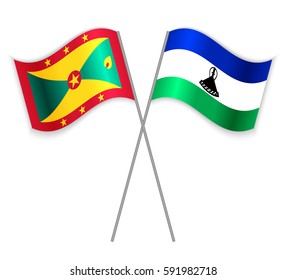 Grenadian and Basotho crossed flags. Grenada combined with Lesotho isolated on white. Language learning, international business or travel concept.