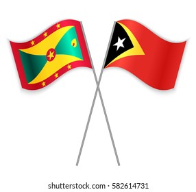 Grenadian and Timorese crossed flags. Grenada combined with East Timor isolated on white. Language learning, international business or travel concept.