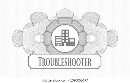 Grey abstract rosette with buildings icon and Troubleshooter text inside