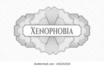 Grey abstract rosette with text Xenophobia inside