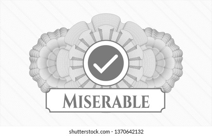 Grey abstract rosette with tick icon and Miserable text inside