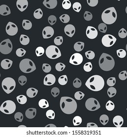 Grey Alien icon isolated seamless pattern on black background. Extraterrestrial alien face or head symbol.  Vector Illustration