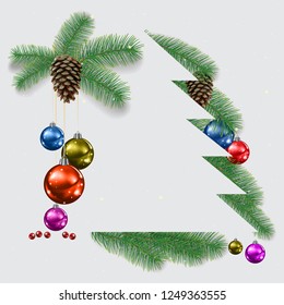 Grey background with Christmas pine branches and decorations.