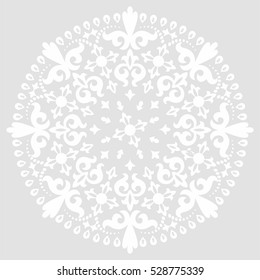 Grey background with white mandala ornament in the east style.