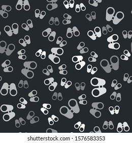 Grey Binoculars icon isolated seamless pattern on black background. Find software sign. Spy equipment symbol.  Vector Illustration