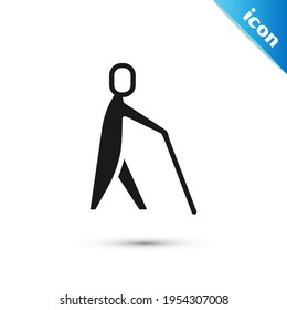 Grey Blind human holding stick icon isolated on white background. Disabled human with blindness.  Vector