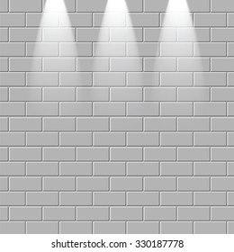 Grey brick wall is illuminated by the rays of light.Empty brick wall with a place for your design