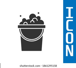 Grey Bucket with soap suds icon isolated on white background. Bowl with water. Washing clothes, cleaning equipment.  Vector