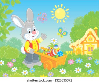 Grey Bunny with a wooden handcart filled with colorfully painted Easter eggs on a lawn in front of a thatched hut on a sunny spring day, vector illustration in a cartoon style