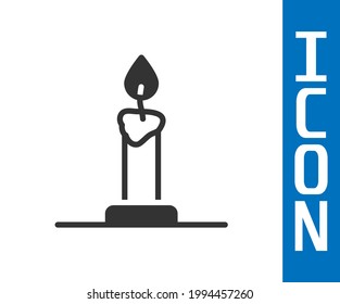 Grey Burning candle in candlestick icon isolated on white background. Cylindrical candle stick with burning flame.  Vector
