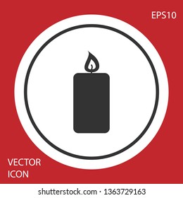 Grey Burning candle icon isolated on red background. Old fashioned lit candle. Cylindrical aromatic candle stick with burning flame. Circle button. Vector Illustration
